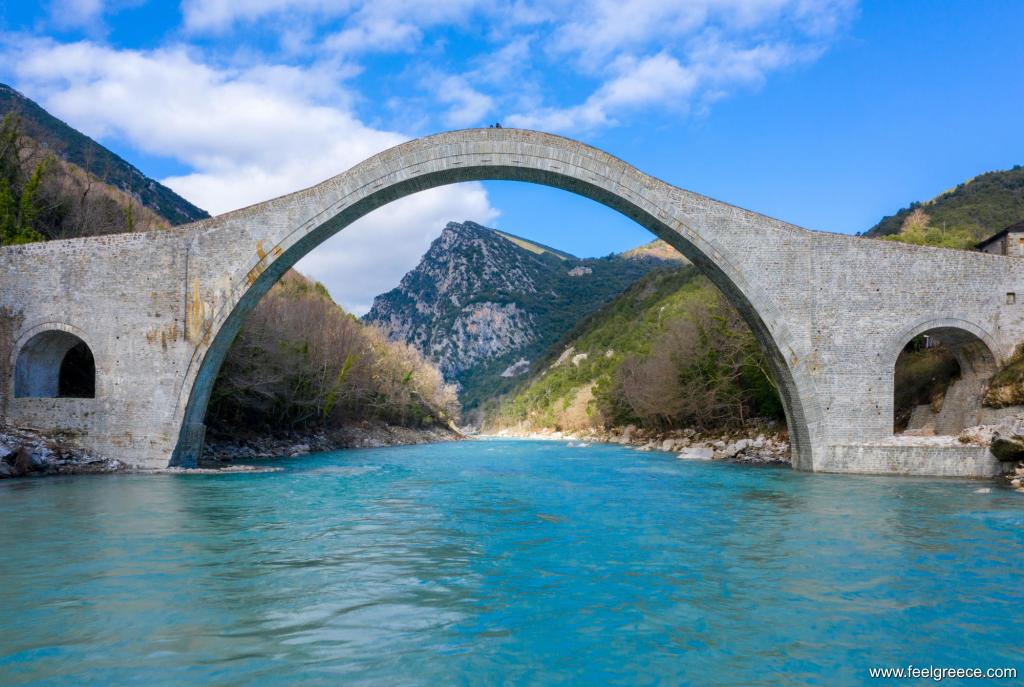 Arched stone bridge on a river