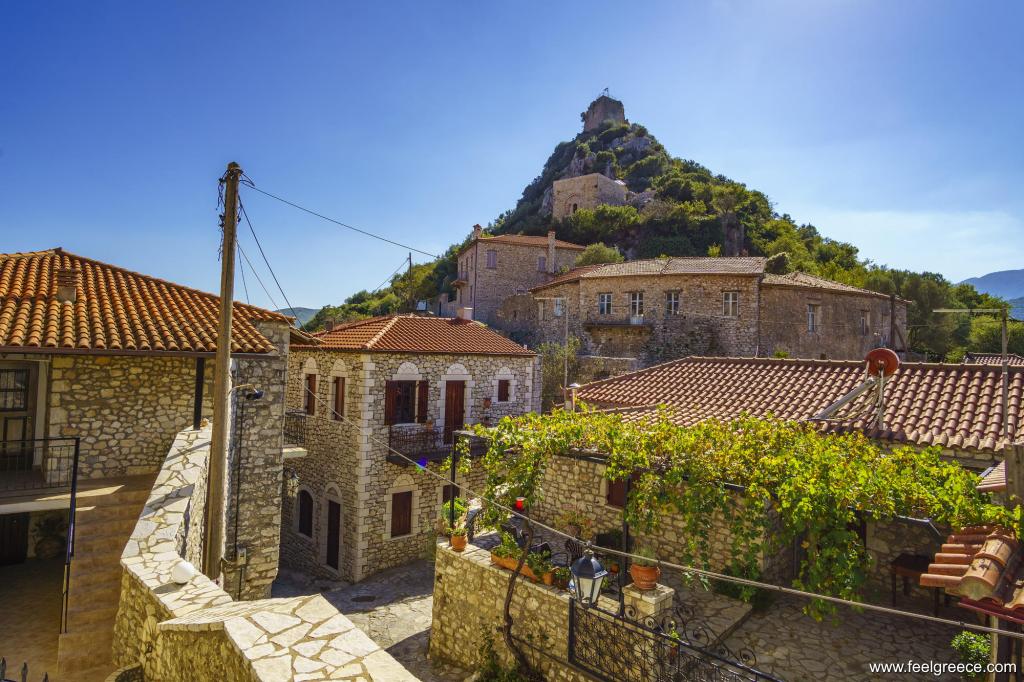Traditional stone houses and a castle atop the hill
