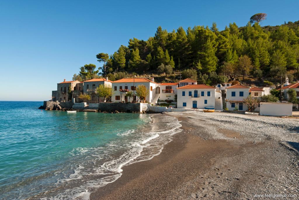 Small beach with tiny pebbles and seafront houses