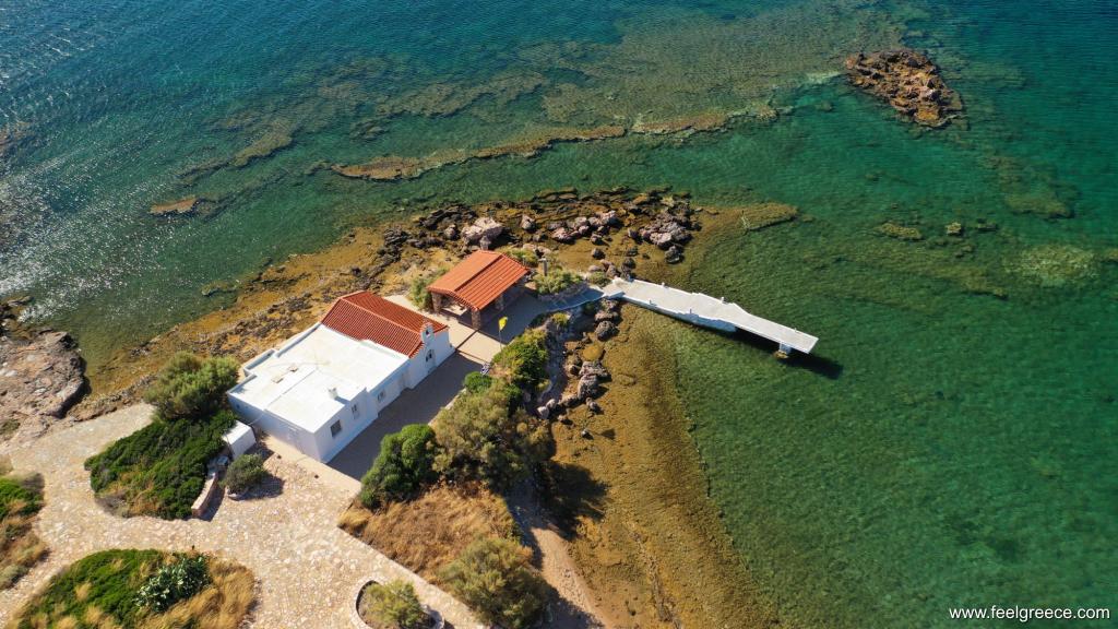 Small church of Ag. Nikolaos built on an islet just off the shore