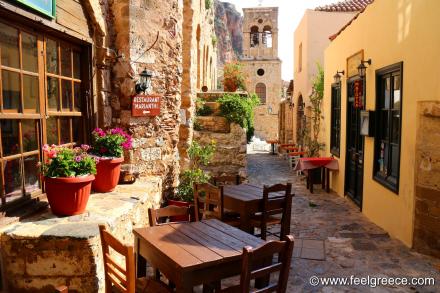 Tables of tavernas in the fortified town in the morning