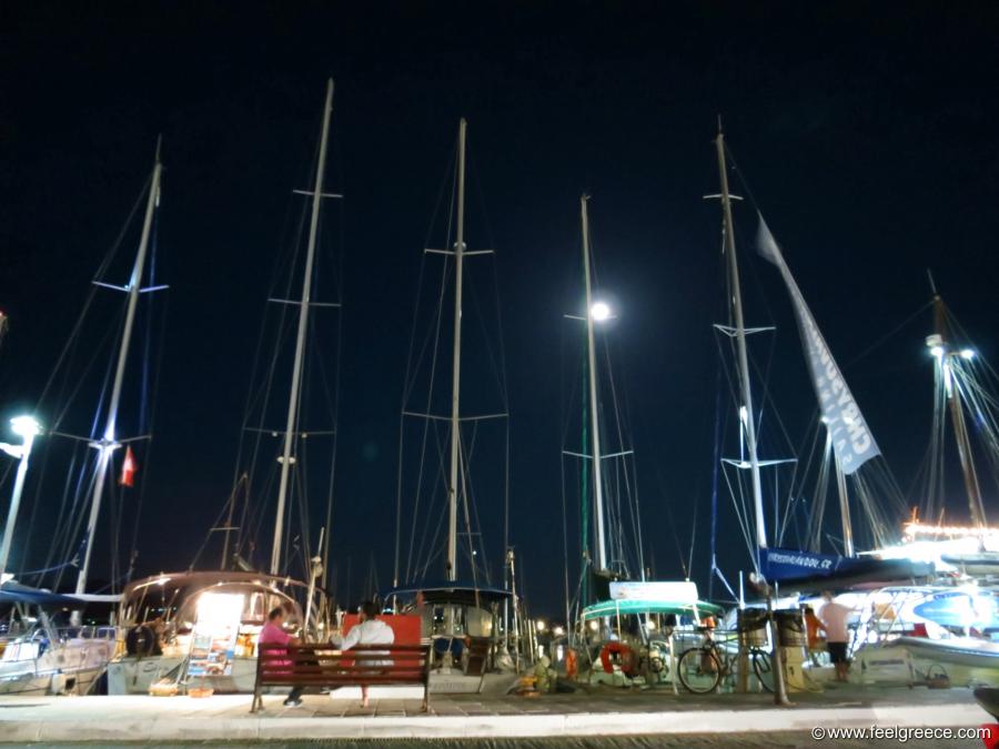 Fool moon between yacht masts
