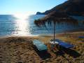 The perfect beach scene - sunbeds, umbrella, sea and sun