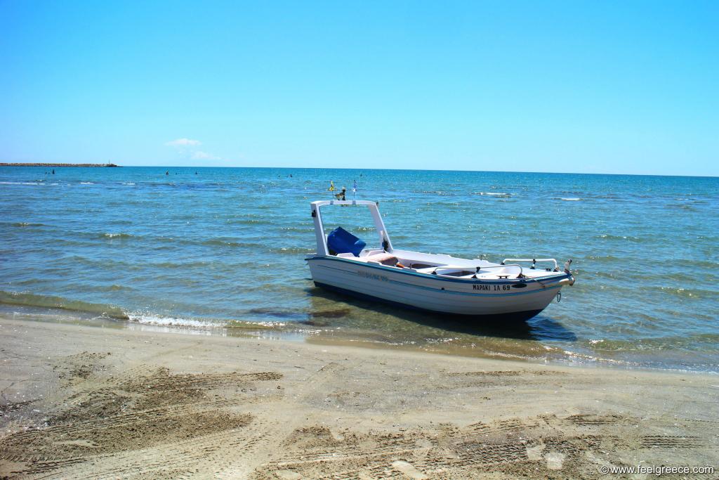 Fishing motor boat stranded at the beach front