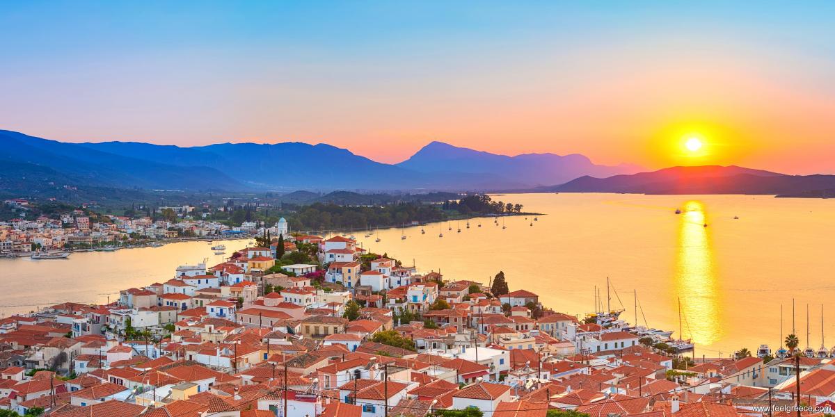 Roof-top houses at sunset and calm sea